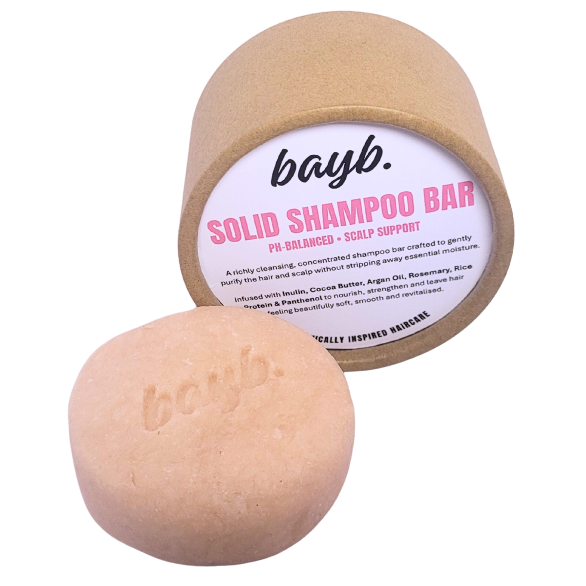 Bayb. Solid Shampoo Bar shown with its kraft paper cylindrical packaging and one loose oval shampoo bar in front on a white background.